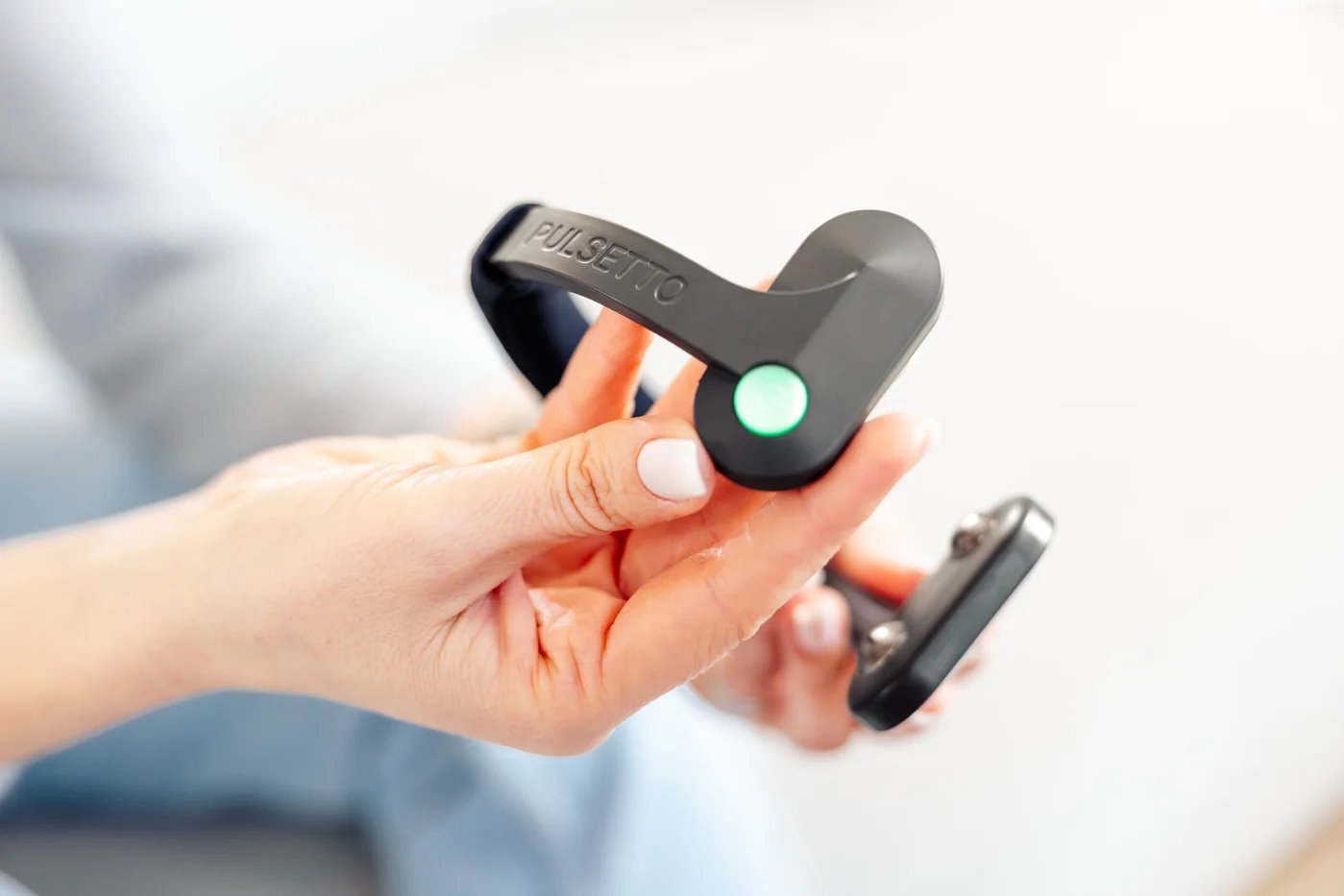 Pulsetto device held before placement for a neck-based transcutaneous vagus nerve stimulation session